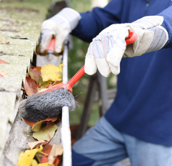 cleaning leaves out of gutter